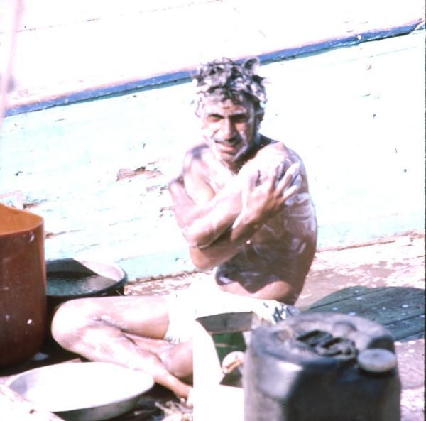 Sailor bathing on Dhow, Dubai Creek